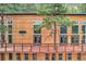 Exterior of a house with a wooden deck and lots of windows overlooking a wooded area at 15175 Rainbow Dr, Sedalia, CO 80135