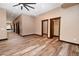 Hallway featuring wood-look floors, neutral paint, recessed lighting and dark stained trim and door frames at 15175 Rainbow Dr, Sedalia, CO 80135