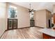 Open-concept living area with a soaring ceiling, expansive windows, hardwood floors, and access to the outdoor at 15175 Rainbow Dr, Sedalia, CO 80135