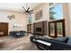 Spacious living room features high ceilings, large windows, stylish furniture, and access to the outdoors at 15175 Rainbow Dr, Sedalia, CO 80135