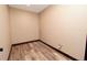 Room with neutral paint, a light, outlets and wood-look floors at 15175 Rainbow Dr, Sedalia, CO 80135