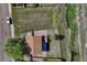 Aerial view shows a tidy home, neatly fenced yard and tranquil neighborhood at 1353 Mallard Ln, Brighton, CO 80601