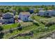 Aerial view featuring the home and its backyard situated near a lovely neighborhood stream at 1353 Mallard Ln, Brighton, CO 80601