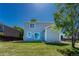Home exterior and backyard showing lush lawn, patio, and easy access sliding door at 1353 Mallard Ln, Brighton, CO 80601
