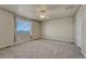 Large bedroom has neutral carpet, neutral walls, and a ceiling fan at 1353 Mallard Ln, Brighton, CO 80601