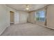 Spacious bedroom featuring neutral walls, plush carpeting, and a ceiling fan at 1353 Mallard Ln, Brighton, CO 80601