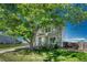 Charming two-story home with mature trees providing shade and curb appeal at 1353 Mallard Ln, Brighton, CO 80601