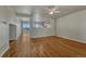 Bright living room with gleaming hardwood floors and views of the lake at 1353 Mallard Ln, Brighton, CO 80601