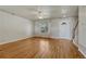 Spacious living room featuring hardwood floors, a ceiling fan, and a staircase at 1353 Mallard Ln, Brighton, CO 80601