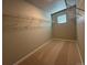 Empty walk-in closet with carpet and wire shelving is ready for organization at 48235 Shetland Dr, Bennett, CO 80102