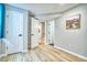 Spacious basement featuring new paint, wood flooring, and a view of the stairway at 5532 S Valdai Way, Aurora, CO 80015