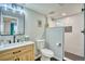 Modern bathroom featuring stylish herringbone shower, vanity, and black fixtures at 5532 S Valdai Way, Aurora, CO 80015