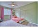 Charming bedroom with a unique canopy bed and pink accents, perfect for a  at 5532 S Valdai Way, Aurora, CO 80015