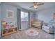 Cozy bedroom with a ceiling fan, window, and comfortable furnishings, perfect for a Bedroom or room at 5532 S Valdai Way, Aurora, CO 80015