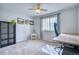 Bedroom featuring a desk, a bookshelf, and a window, providing a functional and comfortable space at 5532 S Valdai Way, Aurora, CO 80015