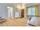 Bright entryway with a view of the front door, stairs, and a console table with a decorative mirror at 5532 S Valdai Way, Aurora, CO 80015