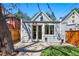 Back of home featuring a manicured lawn and patio at 1612 S Logan St, Denver, CO 80210