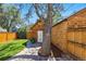 Charming backyard featuring a wooden shed, patio area, green lawn, and string lights for outdoor entertaining at 1612 S Logan St, Denver, CO 80210