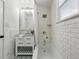 Updated bathroom with subway tile, granite countertop, and modern fixtures at 1612 S Logan St, Denver, CO 80210