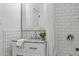 Bathroom featuring subway tile, granite countertop, and modern fixtures at 1612 S Logan St, Denver, CO 80210
