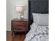 Bedroom featuring a wooden nightstand with a lamp and floral arrangement at 1612 S Logan St, Denver, CO 80210