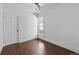 Bright bedroom with hardwood floors, white walls, and a ceiling fan at 1612 S Logan St, Denver, CO 80210