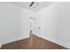 Spacious bedroom featuring hardwood floors, white walls, and a closet at 1612 S Logan St, Denver, CO 80210