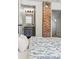 Bedroom showing the entrance to an ensuite bathroom with a gray vanity at 1612 S Logan St, Denver, CO 80210