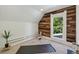Cozy bonus room with wood accent wall and large windows at 1612 S Logan St, Denver, CO 80210