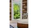 Close up on window with a wood accent wall and white trim at 1612 S Logan St, Denver, CO 80210