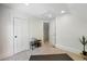 Bright bonus room with neutral carpet and adjacent storage at 1612 S Logan St, Denver, CO 80210