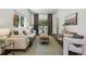 Bright and airy living room with stylish decor, hardwood floors, and large windows at 1612 S Logan St, Denver, CO 80210