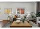 Cozy living room with stylish decor, plush seating, and serene ambiance with ample light at 1612 S Logan St, Denver, CO 80210