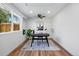 Bright home office with hardwood floors, a modern desk, a ceiling fan, and a window with outdoor views at 1612 S Logan St, Denver, CO 80210