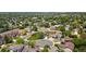 An aerial view showing a residential neighborhood with mature trees and well-maintained lawns, highlighting the community setting at 12814 Forest Cir, Thornton, CO 80241