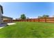 Expansive backyard is enclosed with a wood privacy fence and established lawn at 12814 Forest Cir, Thornton, CO 80241