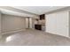 Finished basement with a kitchenette, neutral carpet, and ample storage at 12814 Forest Cir, Thornton, CO 80241