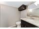 Stylish half bath with granite countertop, modern vanity, and updated fixtures at 12814 Forest Cir, Thornton, CO 80241