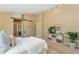 Bright main bedroom boasts a modern sliding door, neutral walls, and stylish décor at 12814 Forest Cir, Thornton, CO 80241