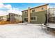 View of backyard, house exterior, and trampoline at 10081 Truckee St, Commerce City, CO 80022