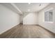Spacious finished basement with wood-look floors and large window at 10081 Truckee St, Commerce City, CO 80022
