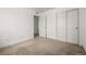 Simple bedroom with double door closet and carpet flooring at 10081 Truckee St, Commerce City, CO 80022