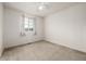 Cozy bedroom with window, carpet, and ceiling fan at 10081 Truckee St, Commerce City, CO 80022