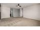 Bright bedroom with ensuite bathroom access and ceiling fan at 10081 Truckee St, Commerce City, CO 80022