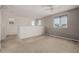 Spacious bedroom with neutral carpeting and a ceiling fan at 10081 Truckee St, Commerce City, CO 80022