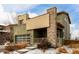 Two-story modern home with stone accents and a large garage at 10081 Truckee St, Commerce City, CO 80022