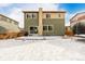 Two-story house exterior, backyard view, and snowy ground at 10081 Truckee St, Commerce City, CO 80022