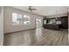 Open concept kitchen with dark cabinetry and a breakfast bar at 10081 Truckee St, Commerce City, CO 80022