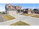 Street view showcasing two-story home with lush lawn and inviting facade at 23893 E Minnow Cir, Aurora, CO 80016