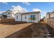 Enjoy the spacious backyard with a large sliding glass door leading to the home's interior at 18953 E 97Th Ave, Commerce City, CO 80022